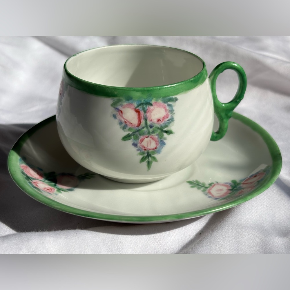 Eagle China Austria. Hand-Painted Floral rose Teacup & Saucer with Green Trim